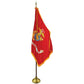 Red flag with a gold border and emblem on a white background